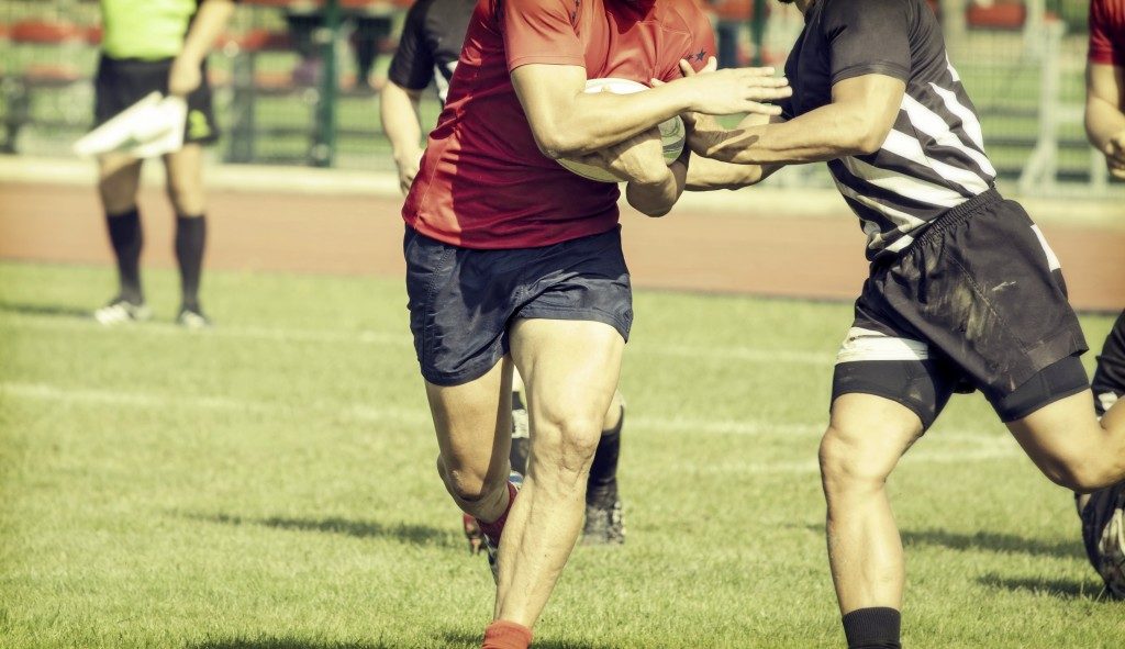 Rugby players fighting for ball